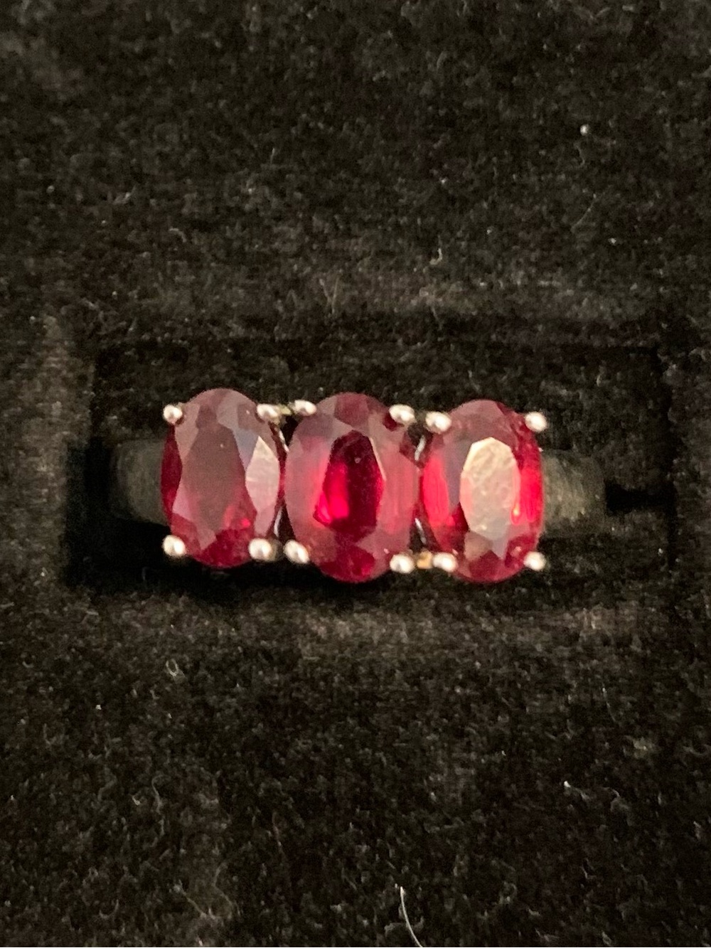 Ring with 3 red stones and .925 sterling silver band Size 8.5/9